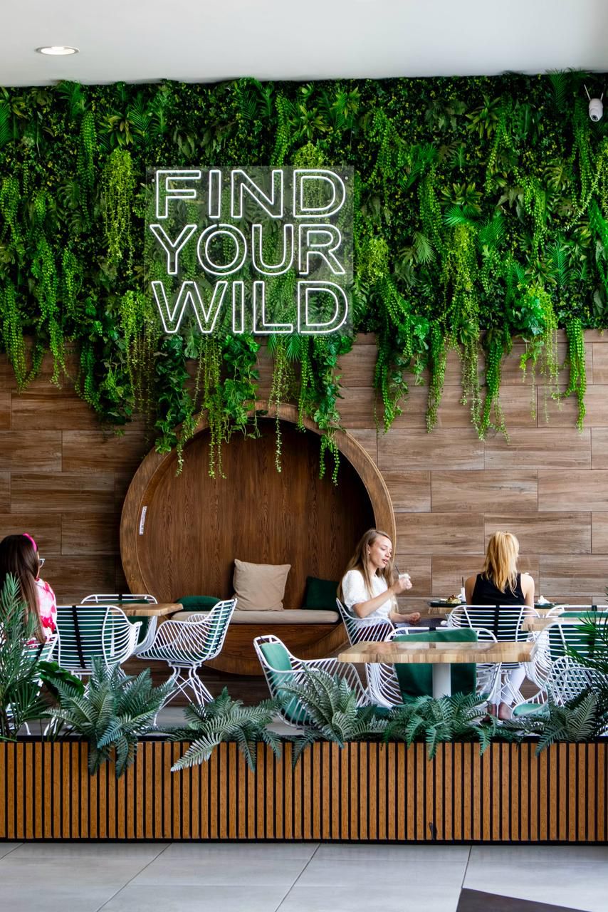 The Wild Café sign and seating area